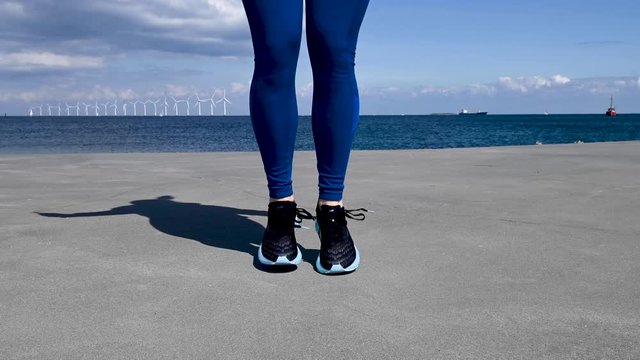 Attractive, fit, young woman jumping rope, stock footage by Brian Holm Nielsen
