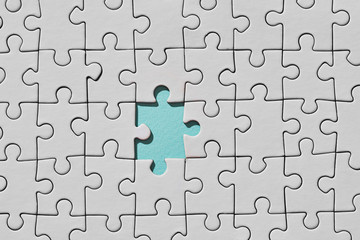 Background of white puzzle with missing piece