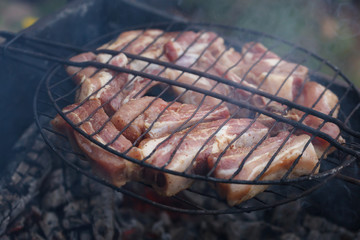 The meat is grilled over charcoal.