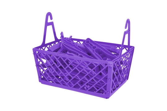 Pile of color plastic cloth clamps inside basket isolated on white background.