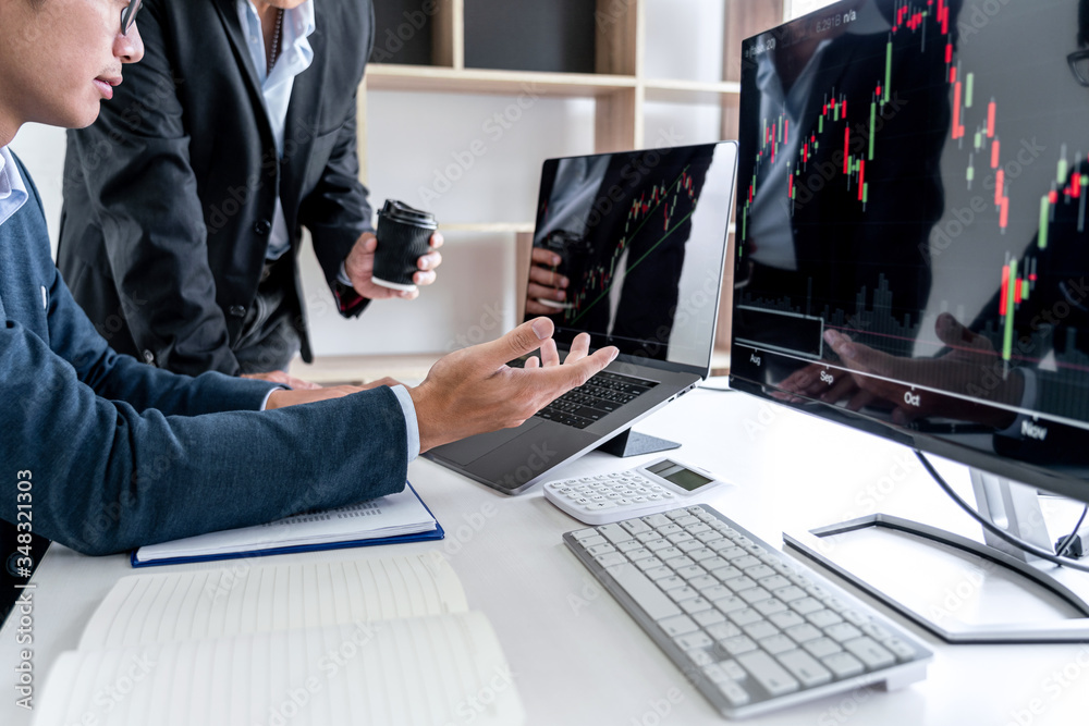 Poster business team partner working with computer, laptop, discussion and analyzing graph stock market tra