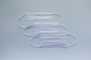 Coronavirus prevention face mask. Social distance, self-isolation during quarantine Covid-19. Safety breathing mask layout, top view, flat lay.