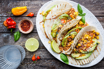 Mexican tacos with meat, beans corn and salsa. Top view
