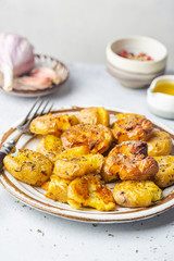 Homemade baked smashed baby potatoes with garlic, salt and herbs
