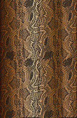 Distressed overlay texture of crocodile or snake skin leather, on golden grunge background.