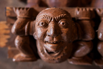 Fototapeta na wymiar close up of a wooden statue face