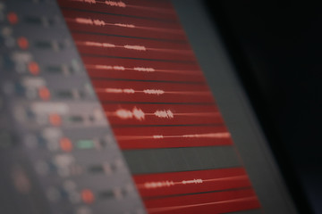 waveform on the notebook monitor recording a sound in an audio editor