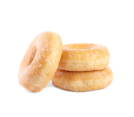Sweet delicious glazed donuts on white background