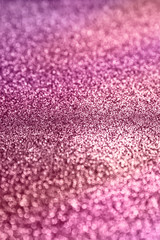 Obraz premium Pink glitter texture sparkling paper background. Abstract twinkled pink glittering background with bokeh, defocused lights for Christmas holiday, banner, wedding invitation and greeting cards.