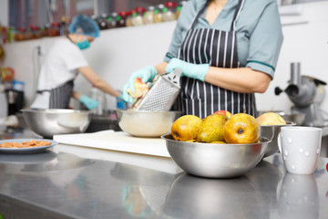 View on fresh pears and apples on the kitchen table