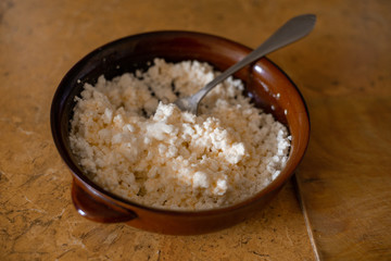 home-made cottage cheese was added egg, sugar for making home-made cheesecakes in clay dishes
