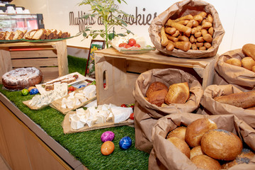 Large assortment of desserts, muffins, cakes, tarts. Candy bar wedding reception brunch buffet