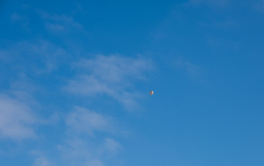 Fototapeta na wymiar Colorful hot-air balloons flying over the mountain in Eben Im Pongau, Austria. January 2020