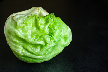 iceberg leaves  lettuce green freshness. Menu concept food background, keto or paleo diet top view. copy space for text