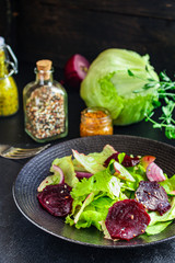 healthy salad beetroot slices, iceberg lettuce, greens. Menu concept food background, keto or paleo diet top view. copy space for text