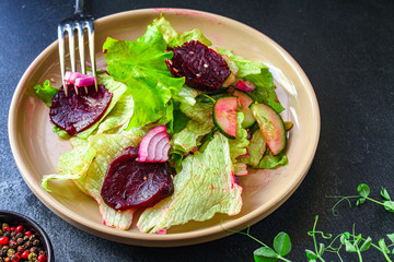 healthy salad beetroot slices, iceberg lettuce, greens. Menu concept food background, keto or paleo diet top view. copy space for text