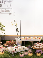 Large assortment of desserts, muffins, cakes, tarts. Candy bar during wedding reception or brunch
