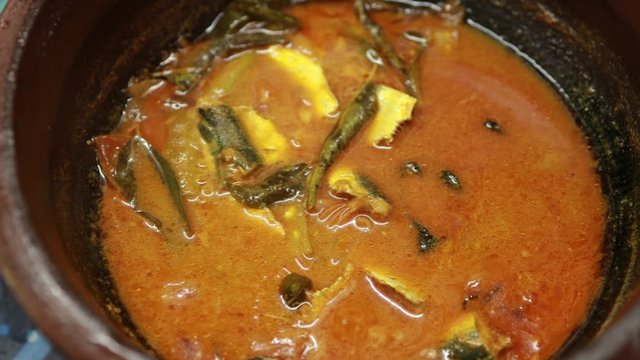 Meen Vattichathu or Pattichathu, sardine fish cooked. Traditional hot and spicy fish curry Kerala India with dried red chilly and green curry leafs. Very popular coastal food eat with tapioca or rice
