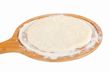Fototapeta na wymiar Dough for Georgian traditional food khachapuri on a wooden dish on white