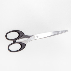 Scissors isolated on bright white background with silver color, top view