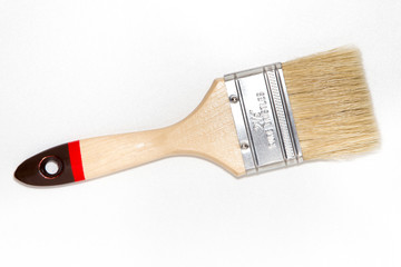 Paint brush isolated on bright white background with silver color, top view