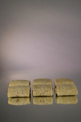 Semi-finished products. Filled Frozen Pancakes. On a mirror background. Isolates.