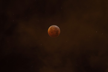 Total lunar eclipse on the night sky with clouds and stars 
