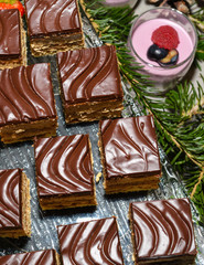 Various desserts in candy bar food buffet during hotel brunch, catering, cake pops, mousse, tarts