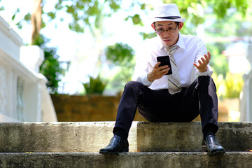 businessman using mobile phone and successful business plan