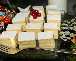Various desserts in candy bar food buffet during hotel brunch, catering, cake pops, mousse, tarts
