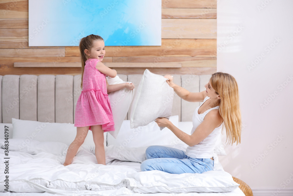 Canvas Prints Mother playing with her child in bedroom at home