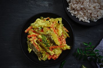 Aviyal - Kerala mixed vegetable curry with coconut and veggies, selective focus