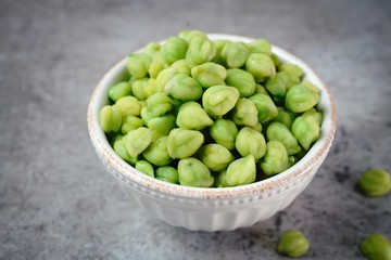 Green Chickpeas or Garbanzo beans in a bowl with copy space