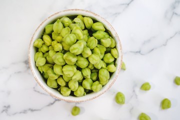 Green Chickpeas or Garbanzo beans in a bowl with copy space