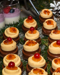 Various desserts in candy bar food buffet during hotel brunch, catering, cake pops, mousse, tarts