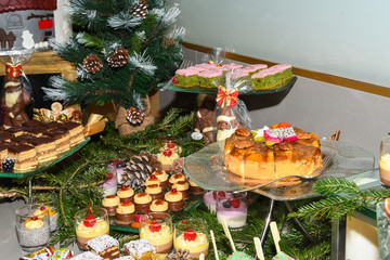 Various desserts in candy bar food buffet during hotel brunch, catering, cake pops, mousse, tarts