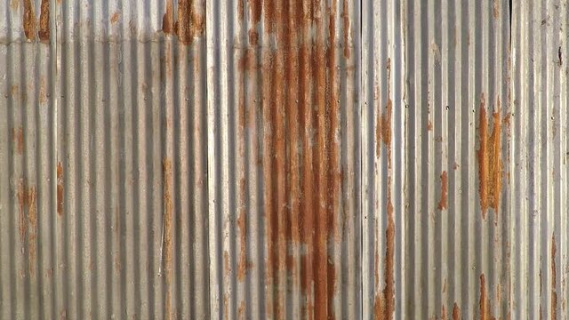 background texture wall fence made of metal rusty sheets