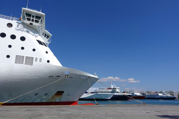 Photo of anchored passenger ferries in busy port of Piraeus on a spring morning, Attica, Greece