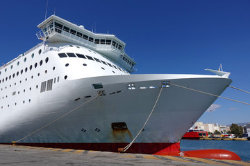 Photo of anchored passenger ferries in busy port of Piraeus on a spring morning, Attica, Greece