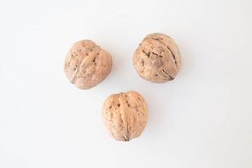  Walnuts on a white background close-up. The concept of vegan and vegetarian. Getting Vitamins from Nuts