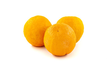 Three oranges isolated on white background. Creative healthy food concept. Flat lay.