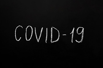 Coronavirus concept. The inscription in white chalk on a black slate background. Epidemic of coronavirus infection. Pandemic. place for text or image placement