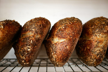 Freshly baked sour dough bread loafs left to cool down at the artesanal bakery. Bread's crust...