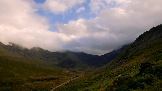Spectacular 4K Time lapse video of Kerry mountains in evening tones with moving clouds and shadows, Ireland