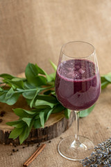 currant smoothie, purple, on a beige background