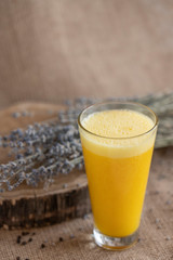 yellow smoothie with lavender bouquet