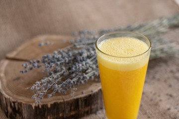 yellow smoothie with lavender bouquet