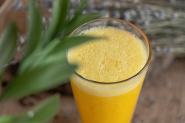 yellow smoothie with lavender bouquet