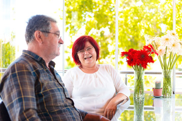 Fototapeta premium Mature couple in quarantine spends time at home on fathers day. chat pleasant time concept.