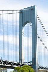 Suspension bridge with vertical lines in a pattern that connects Staten Island to Brooklyn, New York.